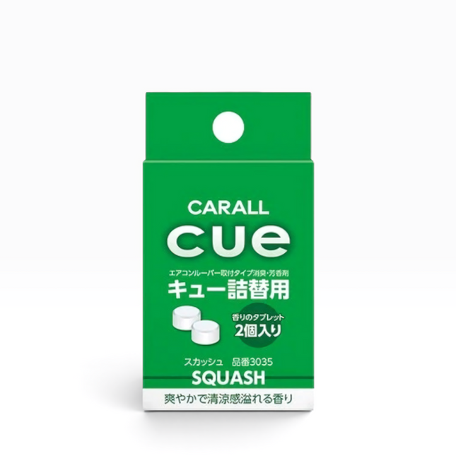 A green rectangular package of CARALL cue Squash cold and flu relief tablets, featuring white text and a small illustration of two white tablets, on a clean white background.