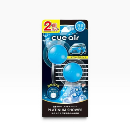 Cue Air Platinum Shower air freshener package, featuring two blue gel capsules on a dark blue and black card with Japanese text and a small car illustration.