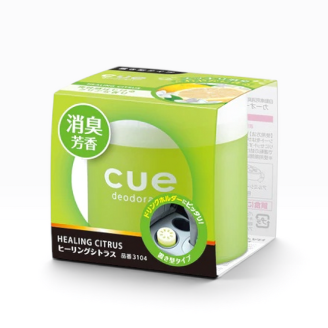 A box of Cue Deodorizer in Healing Citrus scent, featuring a bright green and white packaging design with Japanese text and a small circular graphic of a deodorizer.
