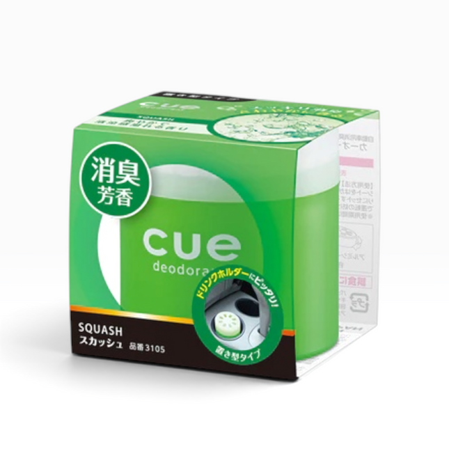 A green and white box of Cue Deodoras Squash scent, featuring Japanese text and a circular window showing the deodorator inside.