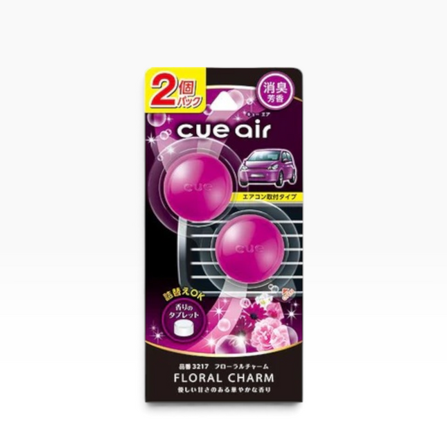 Cue Air Floral Charm 2-pack air freshener packaging, featuring two pink spherical fragrance pods on a black and purple card with Japanese text and floral graphics.
