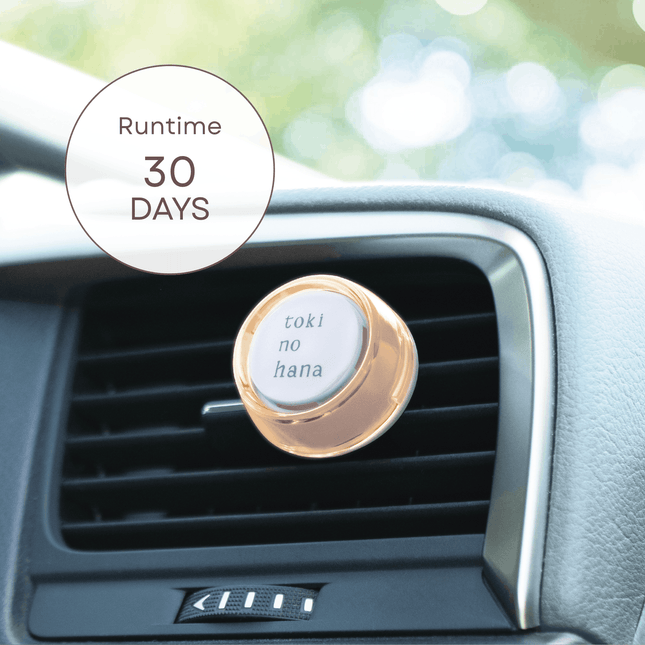 Car air freshener with 'toki no hana' text on a car vent, showing 'Runtime 30 Days' label.