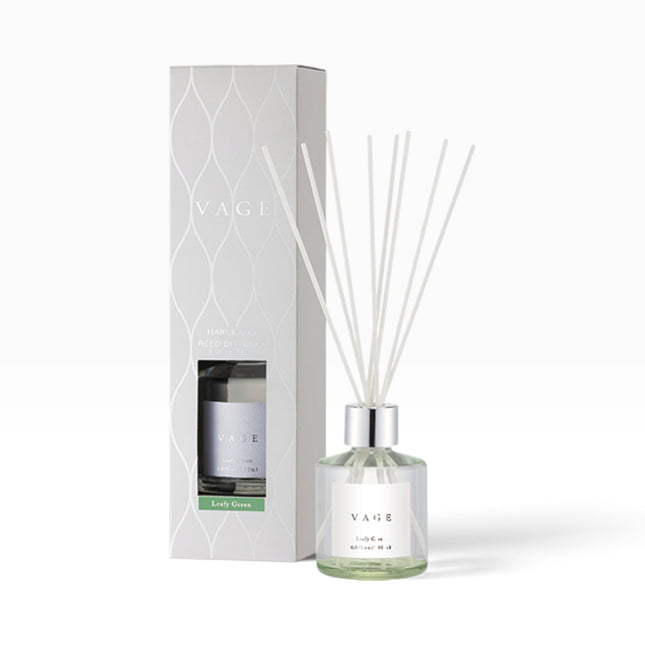VAGE reed diffuser bottle with white reeds next to its white patterned packaging box, labeled 'Early Green' in a soft green accent band, on a clean white background.