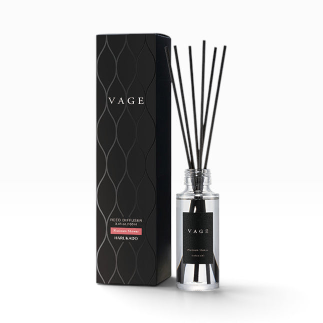 VAGE reed diffuser set with a clear glass bottle, black reeds, and a black textured box on a white background.