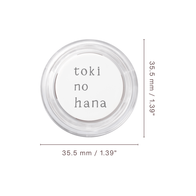 Small round container with 'toki no hana' text on a white background