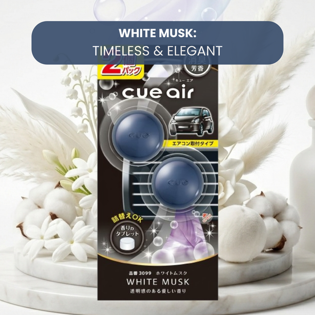 Cue air car air freshener packaging with white musk theme on a decorative background