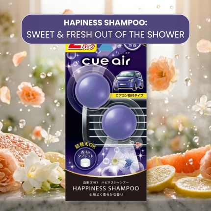 Cue Air Happiness Shampoo packaging with floral and lemon background