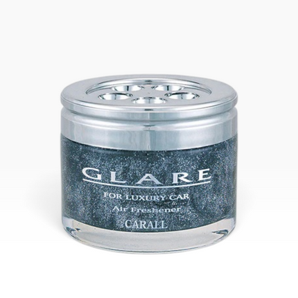 A GLARE luxury car air freshener in a clear glass jar with a metallic silver lid and a dark glittery blue-gray label, on a light gray background.