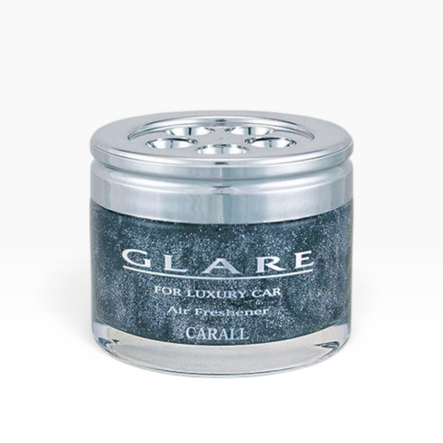 A GLARE luxury car air freshener in a clear glass jar with a metallic silver lid and a dark glittery blue-gray label, on a light gray background.