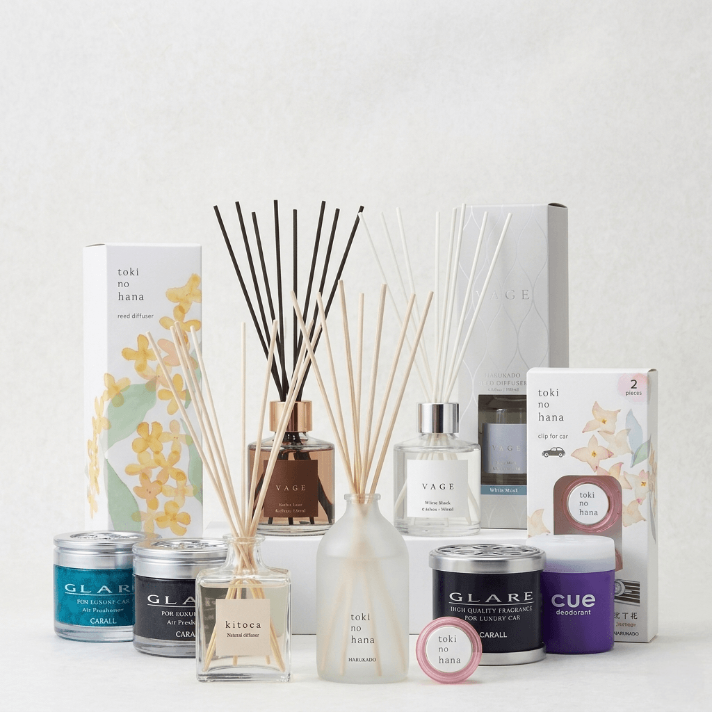 Collection of diffusers and candles on a white background