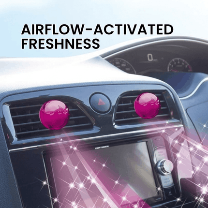 Car air freshener with 'AIRFLOW-ACTIVATED FRESHNESS' text on a blue background