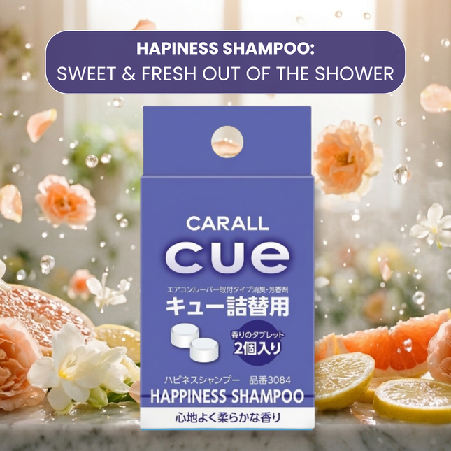 Carall Cue Happiness Shampoo packaging with floral and citrus elements in the background