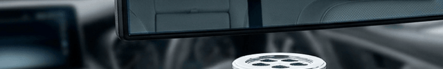 Car air freshener with 'Glare' branding on a car dashboard.
