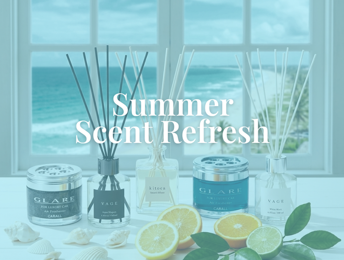 Decorative items with 'Summer Scent Refresh' text, including candles and diffusers with a beach view.
