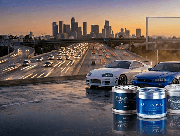 Two cars on a rooftop with a city skyline and highway in the background, featuring GLAD oil products.