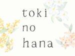 Text 'toki no hana' surrounded by floral elements on a white background