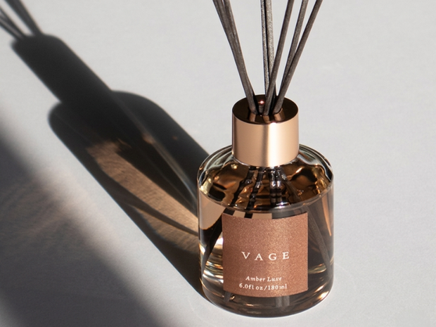 VAGE diffuser with amber label on a light background